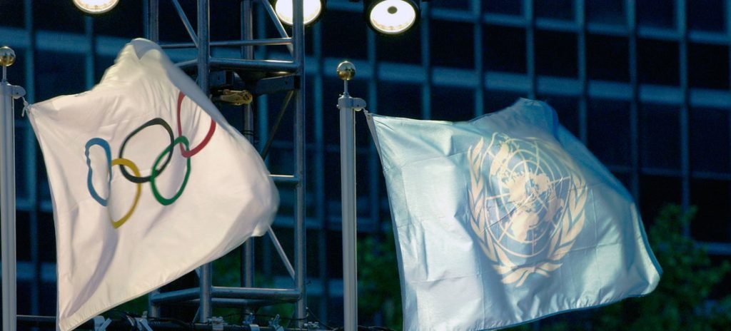 The United Nations and Olympic flags raised at UN Headquarters. (Photo: UN)